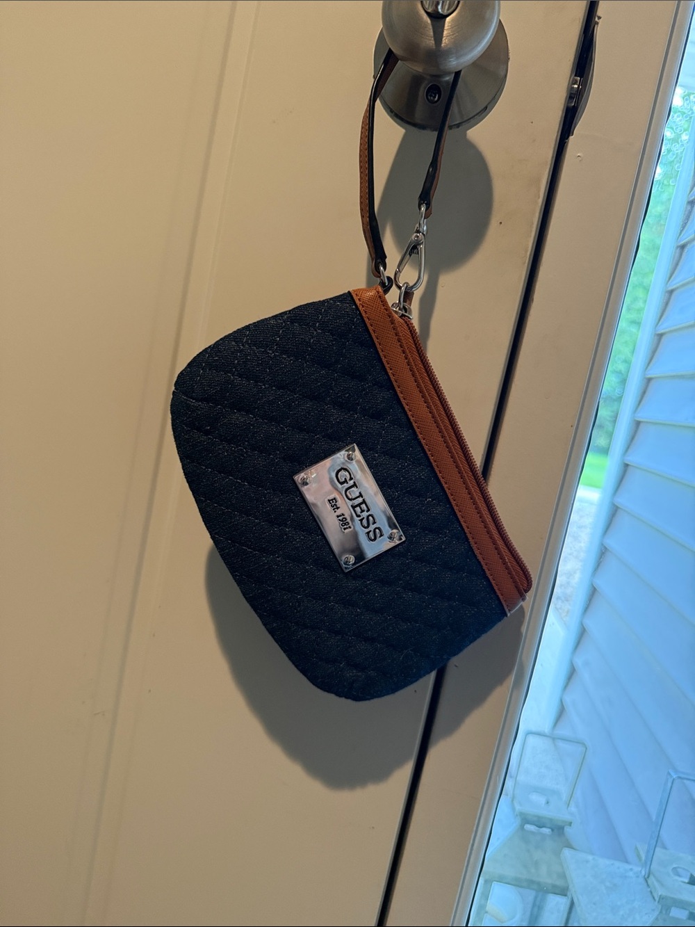 GUESS Quilted Black Wristlet with Brown Trim